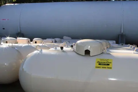 New propane tanks lined up at the yard